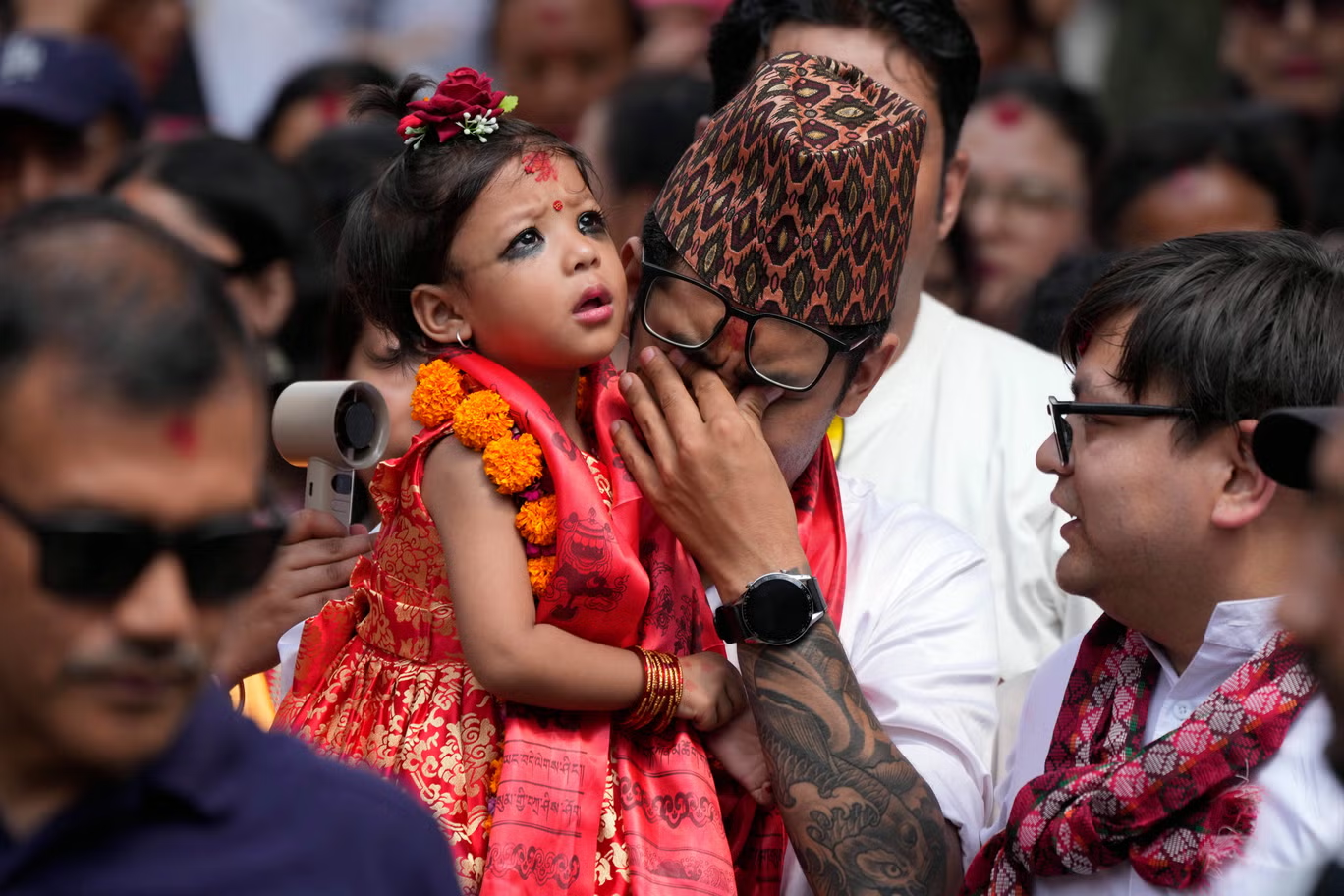 Royal Kumari of Kathmandu, Aryatara Shakya, with her father on the day of her appointment