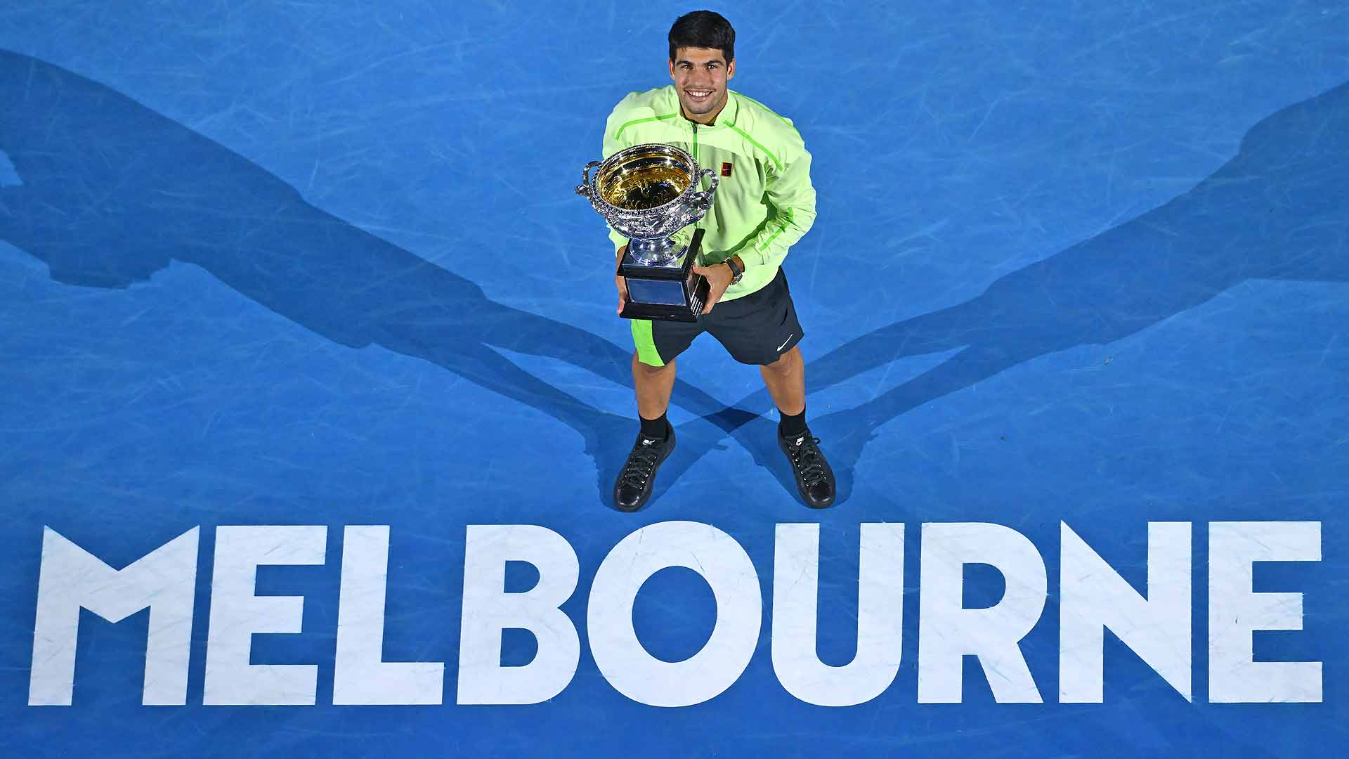 Carlos Alcaraz holding the Australian Open Trophy