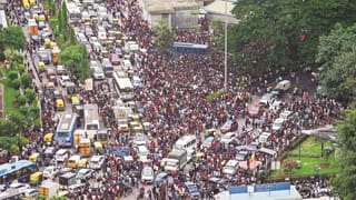 Aerial view of dense crowds and traffic gridlock during the Bangalore stampede incident.