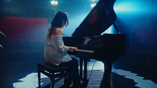 Still from "In Another World" music video via YouTube. 