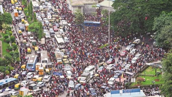 Aerial view of dense crowds and traffic gridlock during the Bangalore stampede incident.
