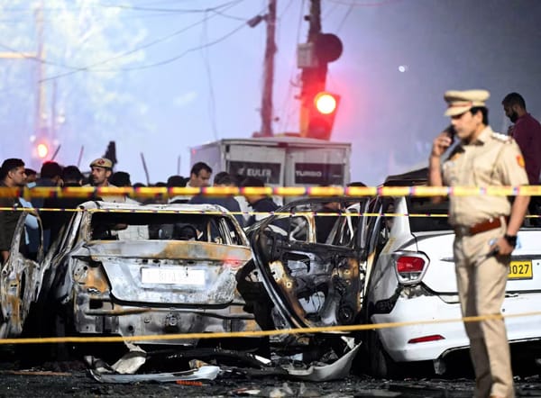 Security and investigation teams inspect the blast site near the Red Fort.